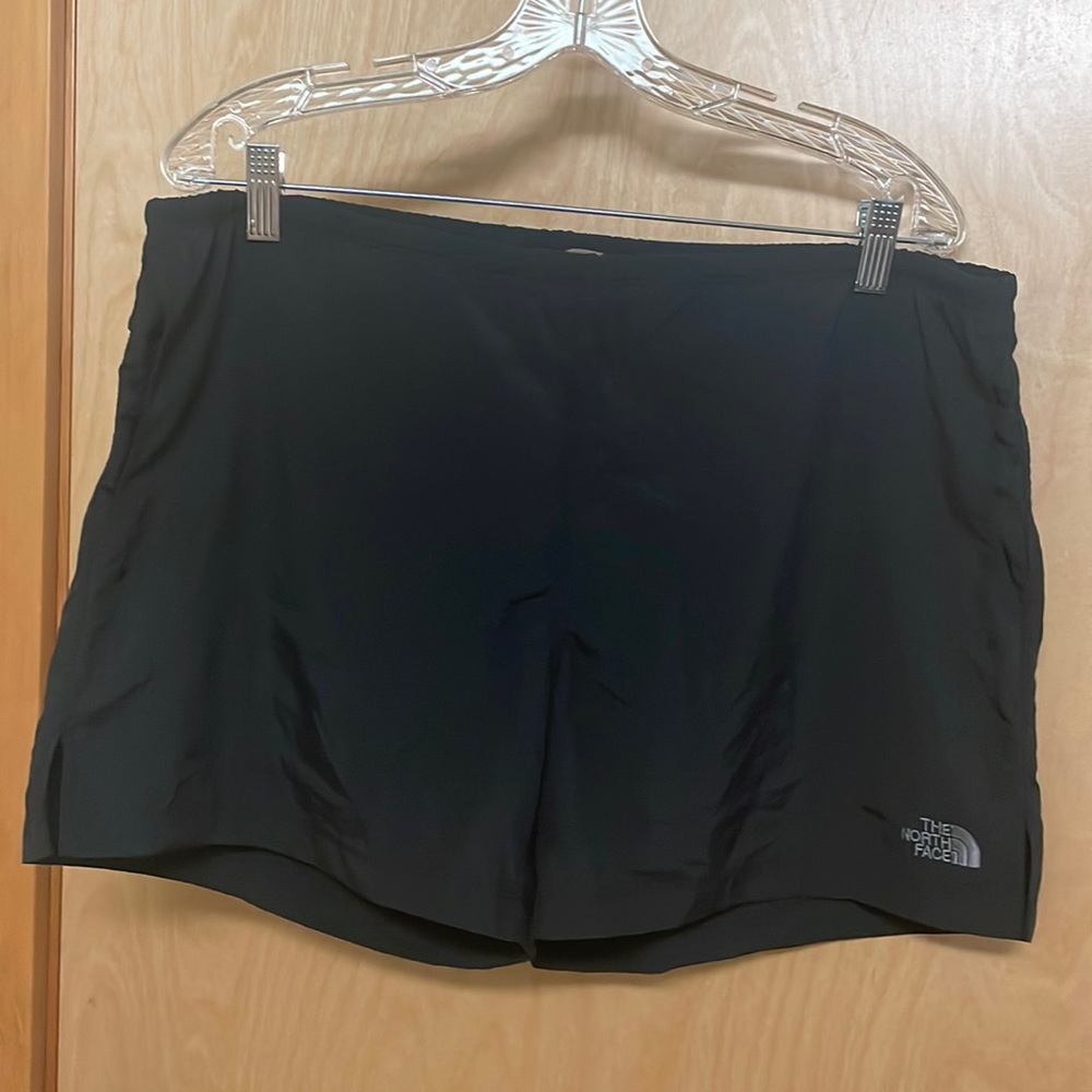 The North Face black nylon shorts. Built in netted underoos. Elastic waist. Sz L